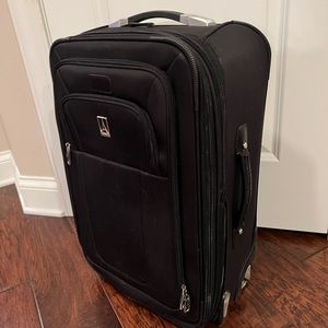 Travelpro 22” Crew 8 Rollaboard. Non-smoking home.